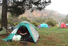 Ben arises from his tent to a misty wet morning at Araps.