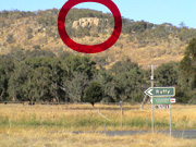 View of the crag from the approach road below.