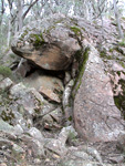 Head straight up, just left of this boulder.