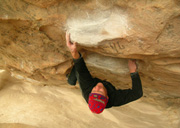 Scott on Spankin the monkey Bars direct, v8, at Hollow Mountain cave.