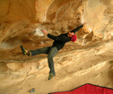 Scott on Spankin the monkey Bars direct, v8, at Hollow Mountain cave.