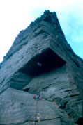 Chris Cope leading through the roof pitch of Passport To Insanity (27) with Simon belaying