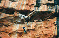 Andrew leading the start of the third pitch (24) of World Party (27), Grampians, Australia. The route goes straight up the water groove after the roof. The groove itself is still overhung by 10-15 degrees. Tim Fahey belaying.