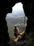 Phil leading out of the belay cave on Trojan.