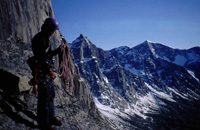 Neil coiling ropes on Mt Thor, Baffin Island, 2002