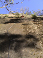 Me belaying atop pitch one of "Let's Go Latin", grade 16.