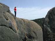 Kathy checks out the view from atop Gravel Pit Tor.