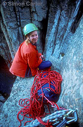 Monique Forestier atop the Totem Pole after becoming the first person to onsight the entire Totem Pole (leading both pitches: 24 and 25). The Totem Pole is an extraordinary 65-metre dolerite column at Cape Hauy, Tasmania, Australia.