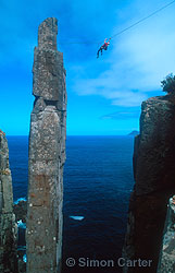 Monique Forestier using a "Tyrolean Traverse" to get off The Totem Pole - a 65-metre dolerite column at Cape Hauy, Tasmania, Australia.
