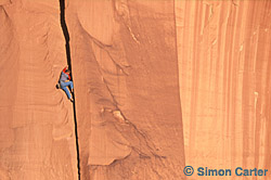 Jason 'Singer' Smith soloing Tweety (5.10), Cat Wall, Indian Creek, Utah, USA.